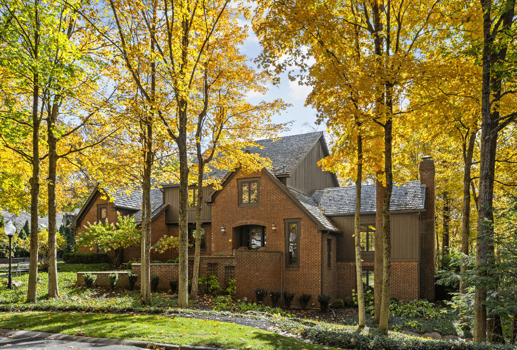 brick home surrounded by autumn leaves in carmel indiana